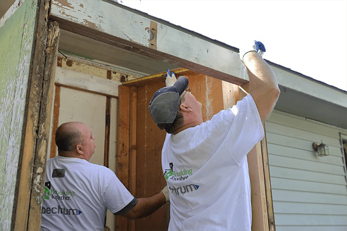 Mike Frizzell/Operation 100 News. Spectrum employees, local volunteers spruce up damaged Shawnee home